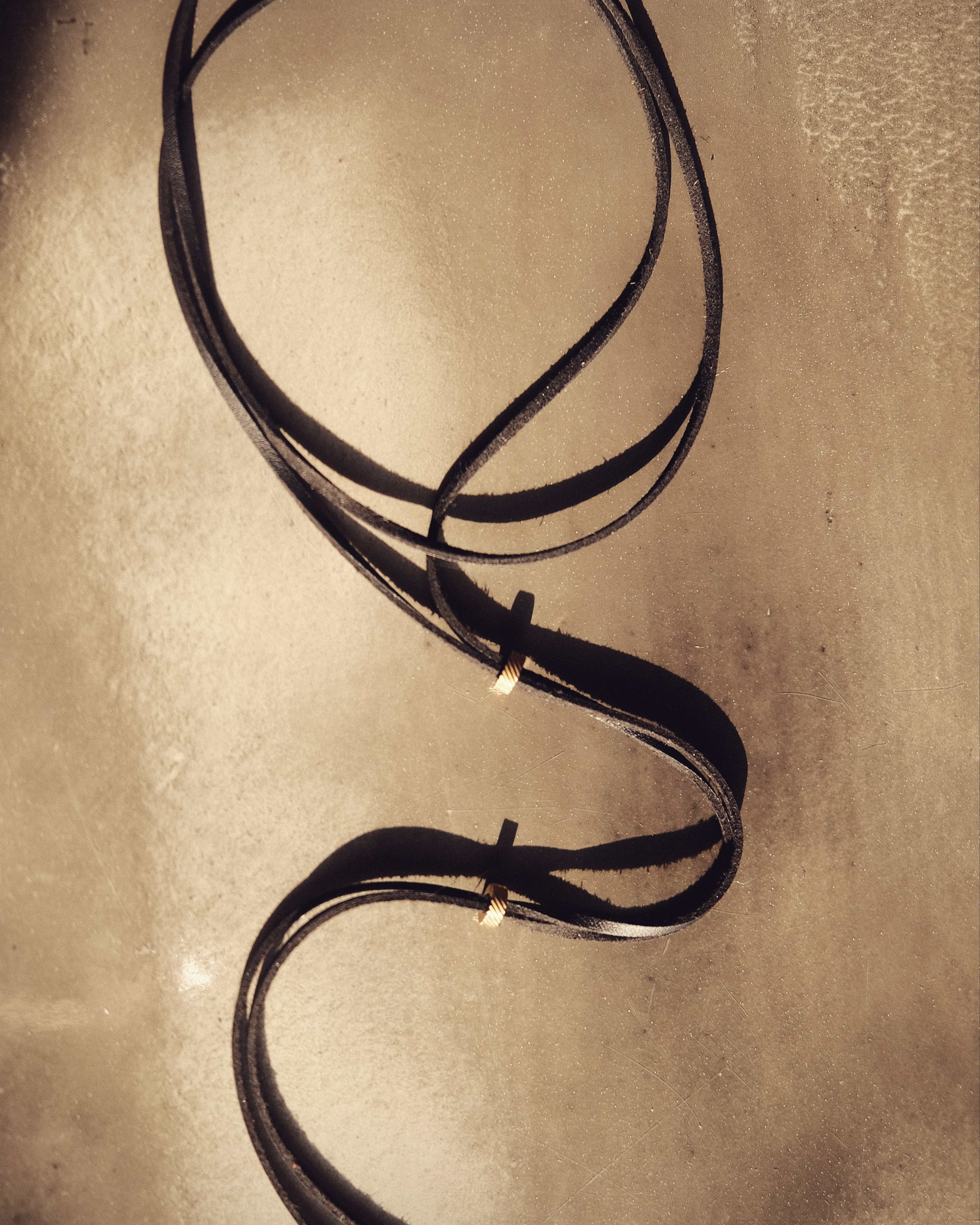 Black vegan leather cord, embellished with stainless steel beads. Bold, timeless, sensual.