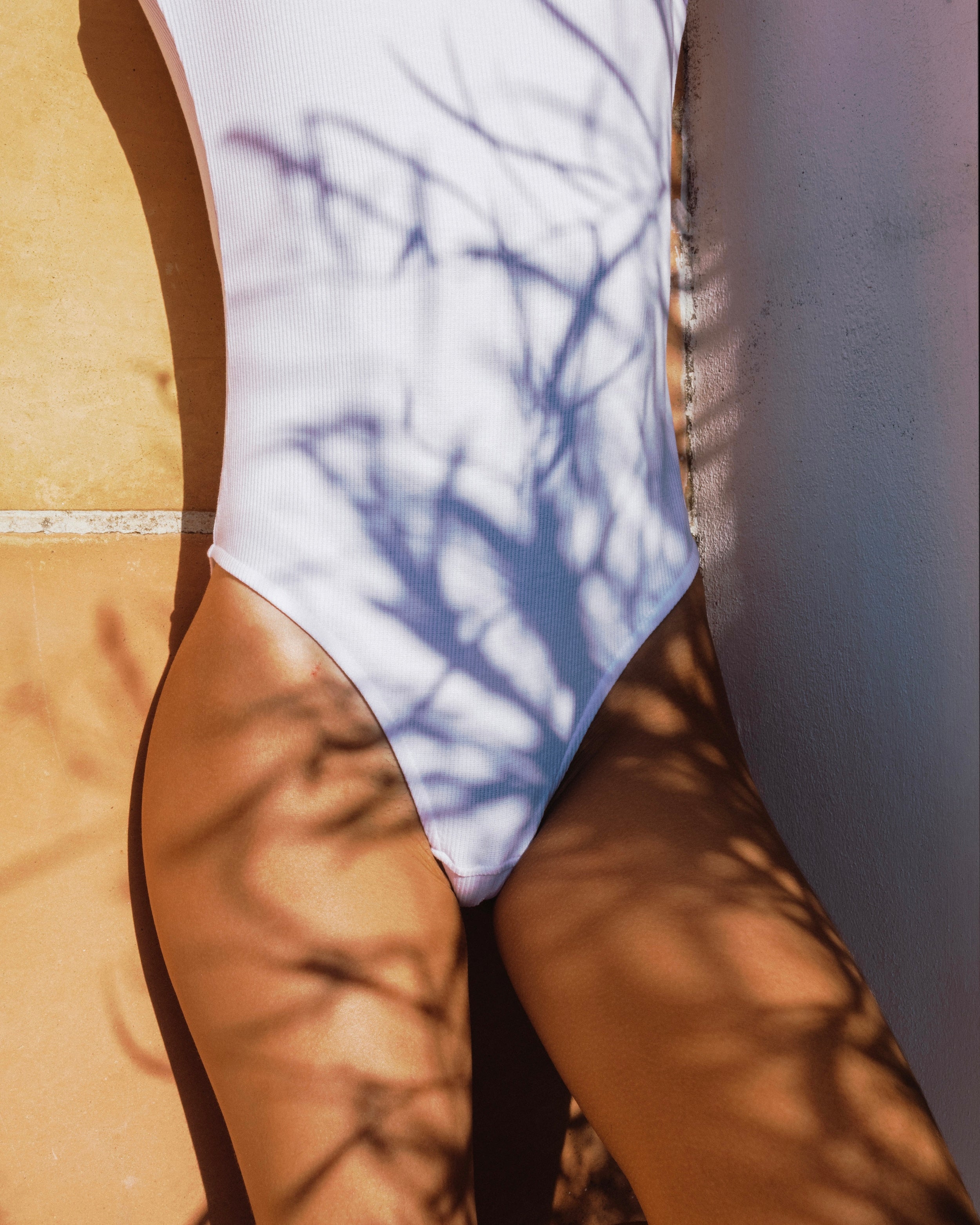 Marcel. White ribbed bodysuit plunging back 
