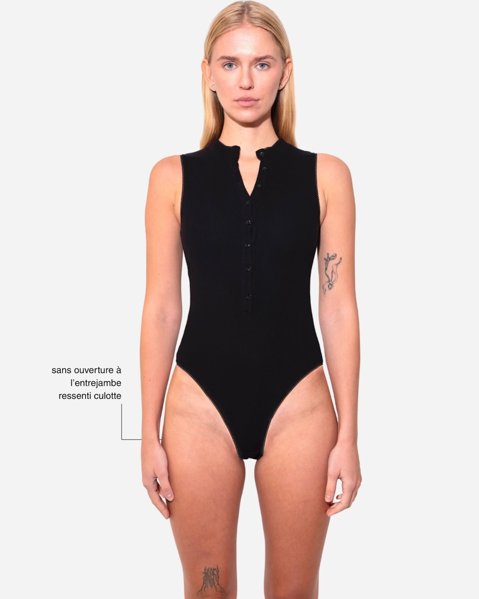 Fauve. Black bodysuit. Sleeveless, high waist and buttoned at the front.